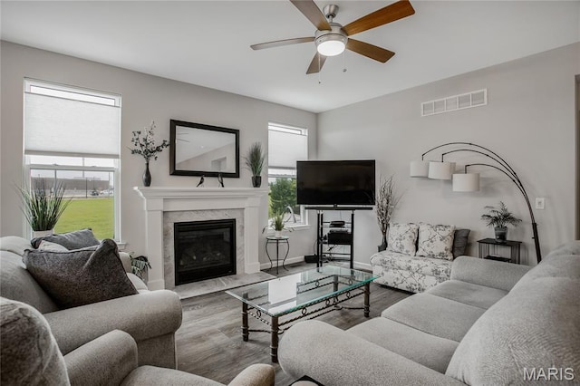 191 Noahs Mill Dr, Lake St Louis, MO 63367 - living area with wood finished floors, a ceiling fan, and a high end fireplace