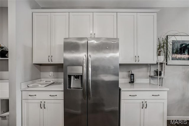191 Noahs Mill Dr, Lake St Louis, MO 63367 - kitchen featuring stainless steel refrigerator with ice dispenser, light countertops, and white cabinetry