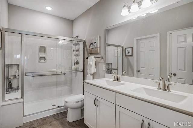 191 Noahs Mill Dr, Lake St Louis, MO 63367 - full bathroom featuring a shower stall, double vanity, and wood finished floors