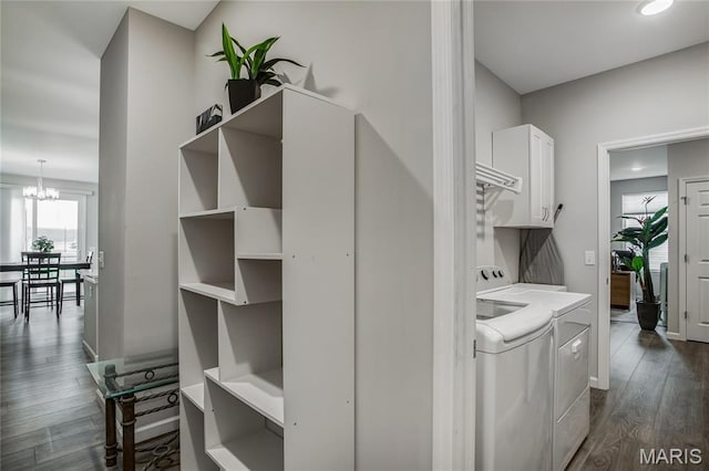 191 Noahs Mill Dr, Lake St Louis, MO 63367 - hallway featuring washing machine and clothes dryer, dark wood-style flooring, and a chandelier