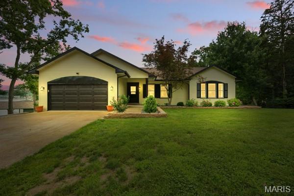 5 Sherman Ct, Hillsboro, MO 63050 - ranch-style house featuring an attached garage, concrete driveway, and a front lawn