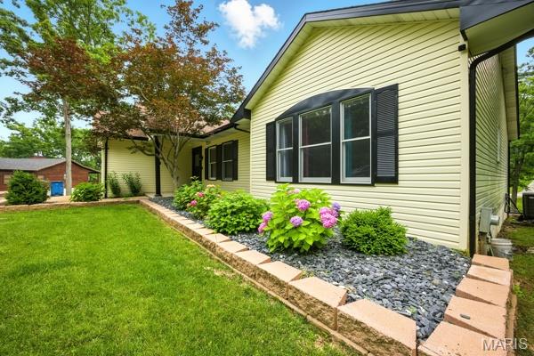 5 Sherman Ct, Hillsboro, MO 63050 - view of side of home with a yard and a central air condition unit