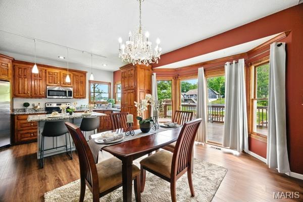 5 Sherman Ct, Hillsboro, MO 63050 - dining area featuring dark wood-style floors and a chandelier