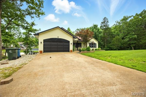 5 Sherman Ct, Hillsboro, MO 63050 - ranch-style house with a garage, concrete driveway, and a front yard