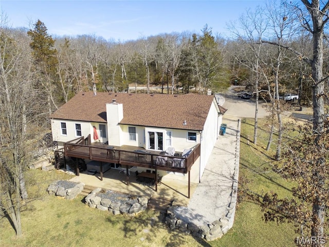 5 Sherman Ct, Hillsboro, MO 63050 - back of property with a wooden deck, a chimney, a patio area, a lawn, and roof with shingles