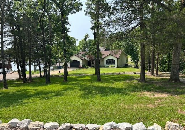 5 Sherman Ct, Hillsboro, MO 63050 - view of grassy yard featuring a garage