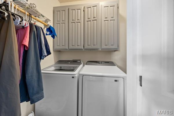 5 Sherman Ct, Hillsboro, MO 63050 - washroom featuring separate washer and dryer and cabinet space