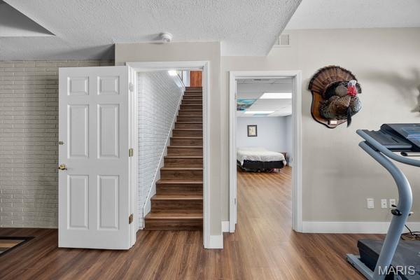 5 Sherman Ct, Hillsboro, MO 63050 - staircase featuring wood finished floors and a textured ceiling