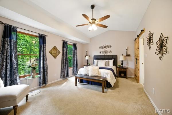 5 Sherman Ct, Hillsboro, MO 63050 - bedroom featuring a barn door, light carpet, lofted ceiling, and ceiling fan