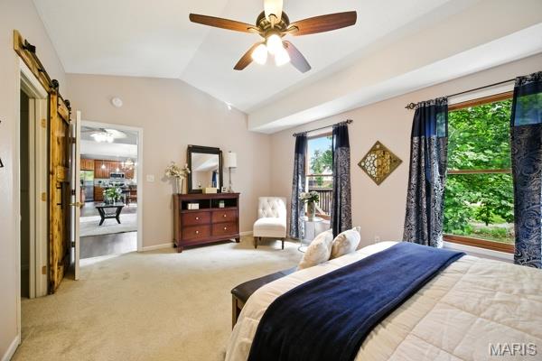5 Sherman Ct, Hillsboro, MO 63050 - bedroom featuring lofted ceiling, multiple windows, light carpet, a barn door, and a ceiling fan