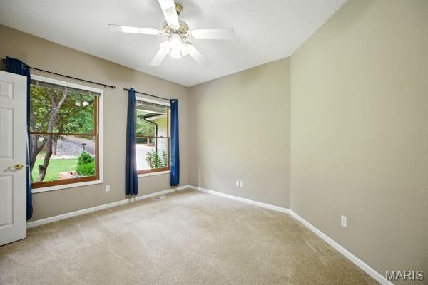 5 Sherman Ct, Hillsboro, MO 63050 - spare room with ceiling fan, light colored carpet, and a textured ceiling