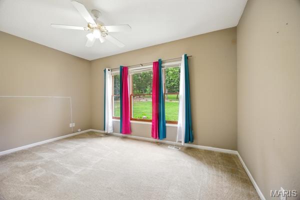 5 Sherman Ct, Hillsboro, MO 63050 - carpeted empty room with baseboards and a ceiling fan