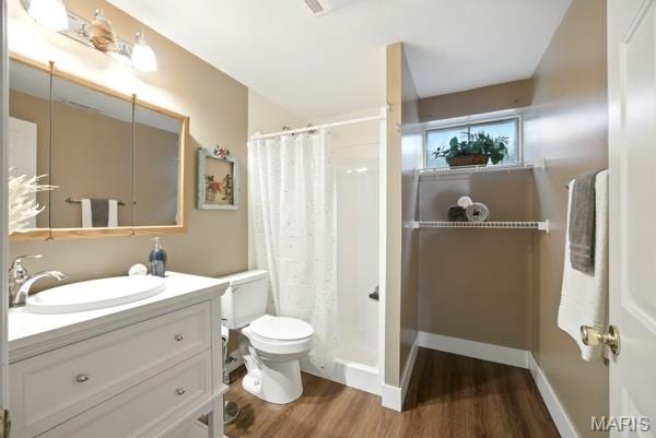 5 Sherman Ct, Hillsboro, MO 63050 - full bathroom with wood finished floors, vanity, and a shower with curtain