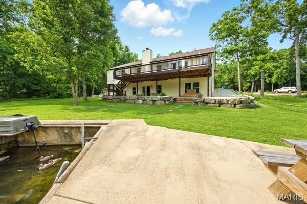 5 Sherman Ct, Hillsboro, MO 63050 - back of property with a wooden deck, a yard, stairway, and a chimney