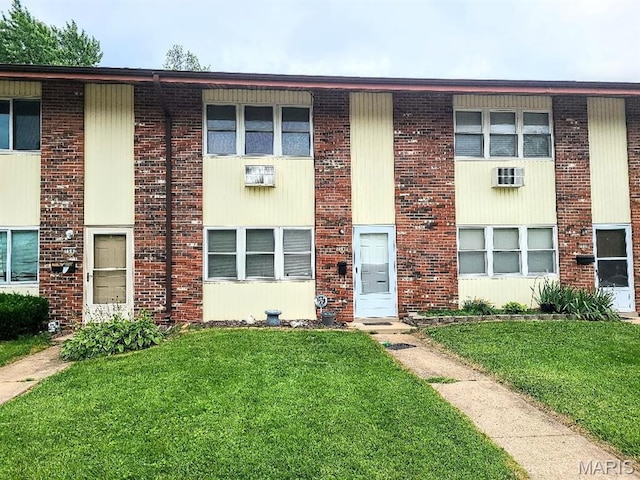 7540 Hazelcrest Dr, Hazelwood, MO 63042 - view of property with a front lawn and brick siding