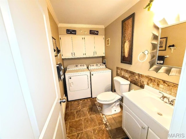 7540 Hazelcrest Dr, Hazelwood, MO 63042 - half bath featuring washer and dryer, ornamental molding, and vanity