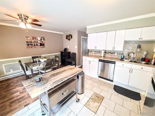 7540 Hazelcrest Dr, Hazelwood, MO 63042 - kitchen with dishwasher, a ceiling fan, decorative backsplash, ornamental molding, and light countertops