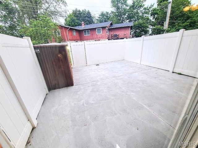 7540 Hazelcrest Dr, Hazelwood, MO 63042 - fenced backyard with a patio