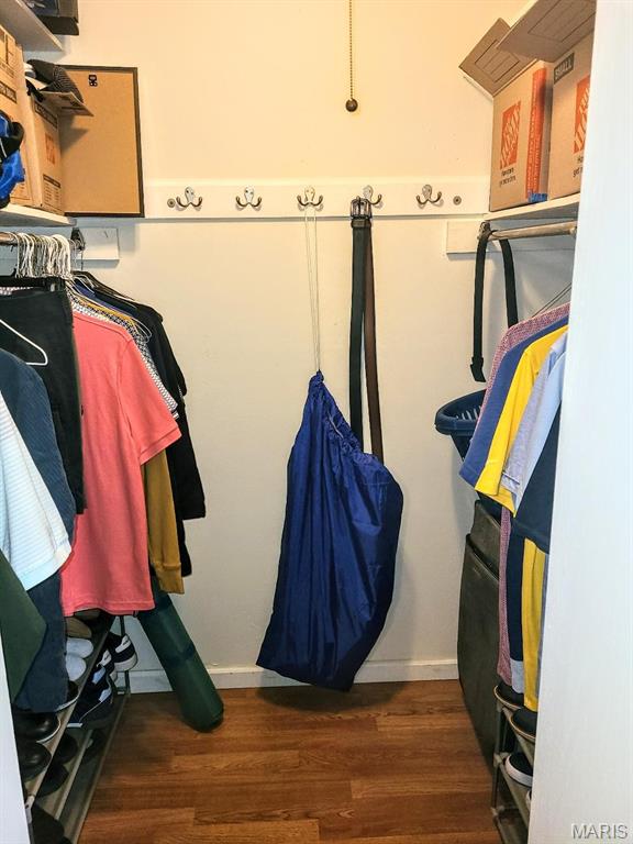 7540 Hazelcrest Dr, Hazelwood, MO 63042 - walk in closet with wood finished floors