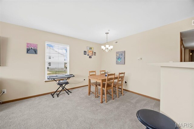 628 Homerun Dr Unit 11N, Ofallon, MO 63366 - carpeted dining area featuring a chandelier and baseboards
