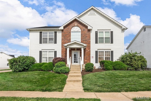 628 Homerun Dr Unit 11N, Ofallon, MO 63366 - view of front of home with a front lawn and brick siding