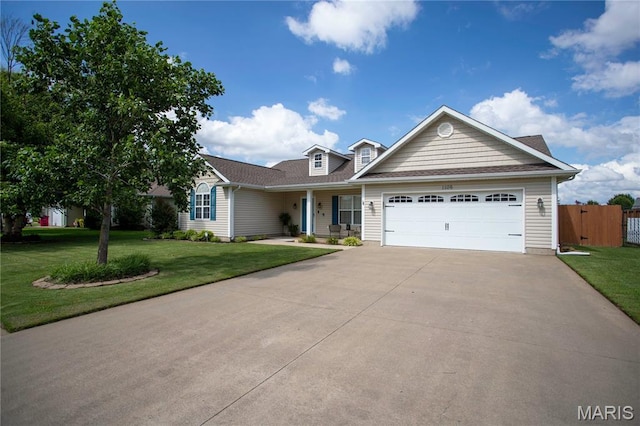 1106 Tulip Trce, Sikeston, MO 63801 - view of front of home featuring an attached garage, driveway, and a porch