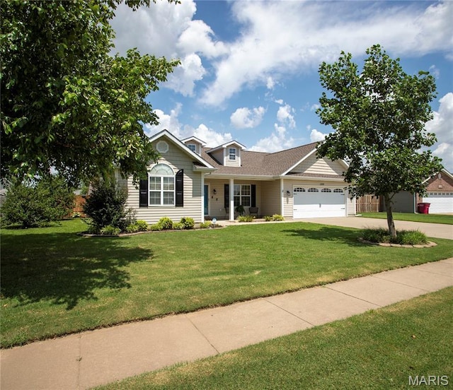 1106 Tulip Trce, Sikeston, MO 63801 - view of front of property with a garage, a front yard, and concrete driveway