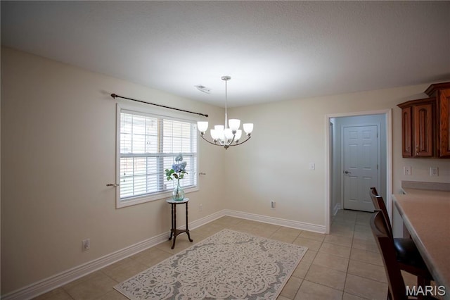 1106 Tulip Trce, Sikeston, MO 63801 - dining area featuring a chandelier and light tile patterned flooring