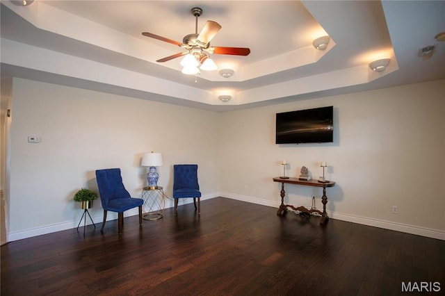1106 Tulip Trce, Sikeston, MO 63801 - living area featuring a raised ceiling, ceiling fan, and wood finished floors