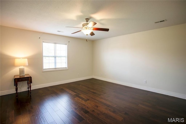 1106 Tulip Trce, Sikeston, MO 63801 - empty room with ceiling fan and dark wood finished floors