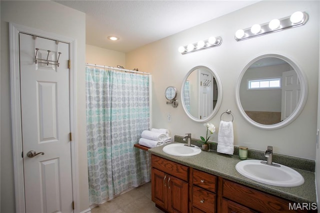 1106 Tulip Trce, Sikeston, MO 63801 - full bathroom with double vanity, tile patterned floors, and a shower with shower curtain