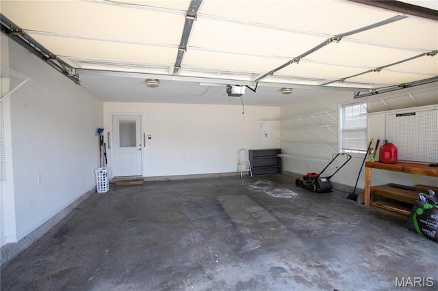 1106 Tulip Trce, Sikeston, MO 63801 - garage featuring a garage door opener and baseboards