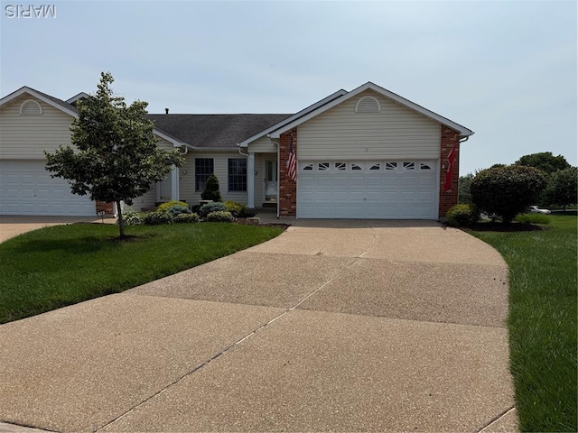 17 Battersea Ct Unit 6B, Ofallon, MO 63366 - single story home with a front yard, driveway, a garage, and brick siding