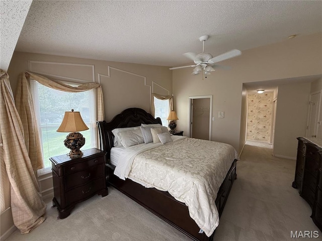 17 Battersea Ct Unit 6B, Ofallon, MO 63366 - bedroom featuring light carpet, multiple windows, a textured ceiling, and ceiling fan