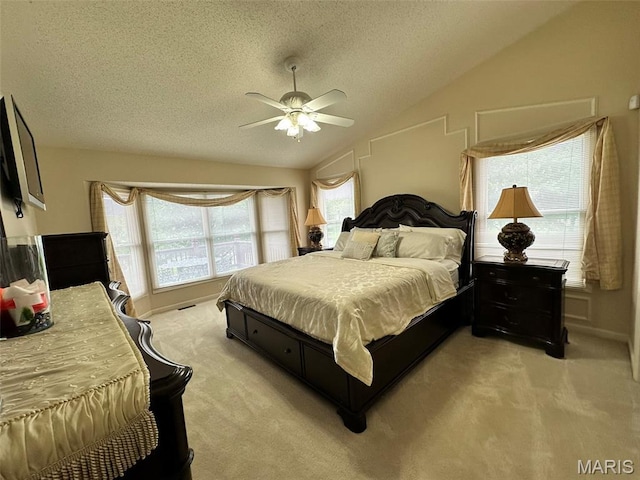 17 Battersea Ct Unit 6B, Ofallon, MO 63366 - bedroom featuring light colored carpet, a textured ceiling, lofted ceiling, and ceiling fan