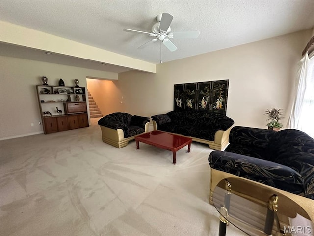 17 Battersea Ct Unit 6B, Ofallon, MO 63366 - living room with stairway, a ceiling fan, carpet floors, and a textured ceiling