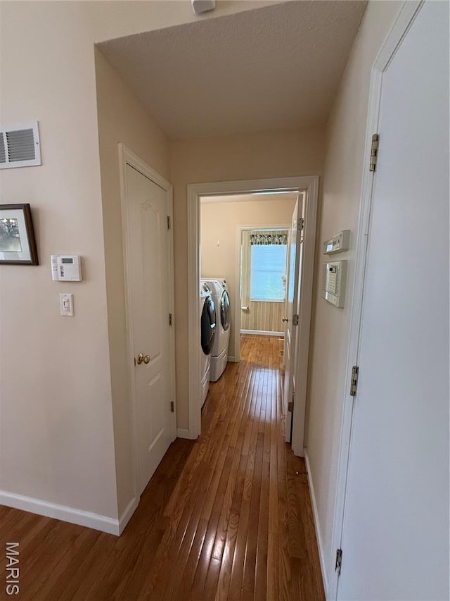 17 Battersea Ct Unit 6B, Ofallon, MO 63366 - laundry area featuring independent washer and dryer and dark wood-style flooring