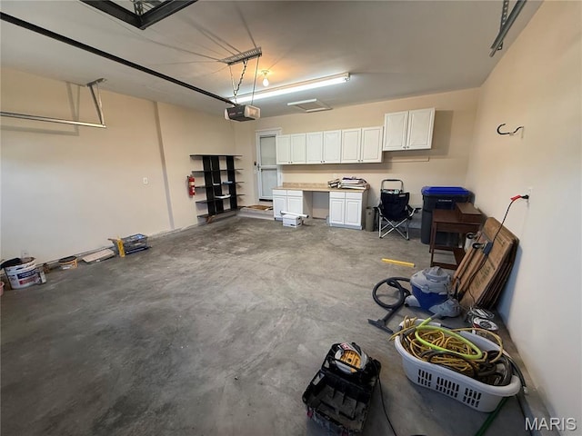 17 Battersea Ct Unit 6B, Ofallon, MO 63366 - garage featuring a garage door opener