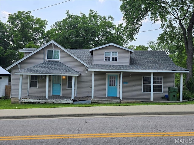 1505 Holloway St, Rolla, MO 65401 - view of front facade featuring roof with shingles and covered porch