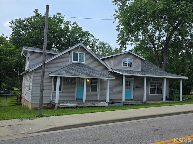 1505 Holloway St, Rolla, MO 65401 - view of front facade with roof with shingles and a porch