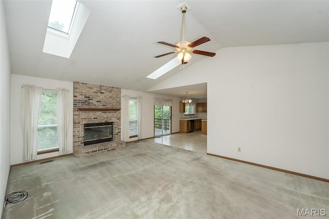 425 Bluffview Hts, Arnold, MO 63010 - unfurnished living room featuring a skylight, a fireplace, a chandelier, carpet, and ceiling fan