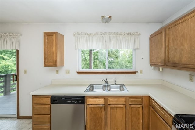 425 Bluffview Hts, Arnold, MO 63010 - kitchen with stainless steel dishwasher, stove, light countertops, and brown cabinets