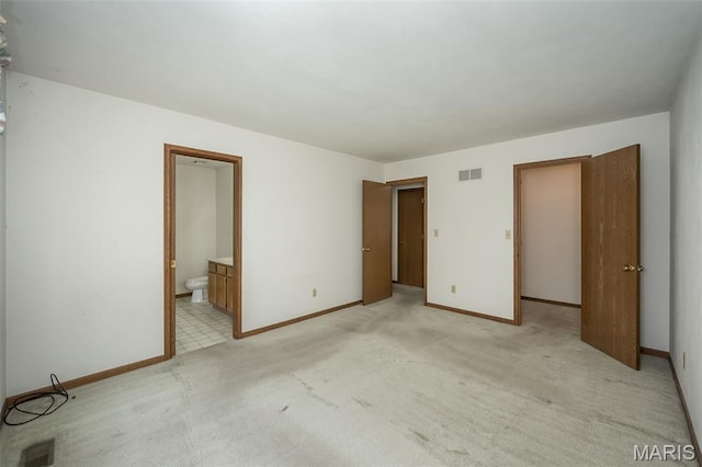 425 Bluffview Hts, Arnold, MO 63010 - unfurnished bedroom featuring light carpet and ensuite bathroom