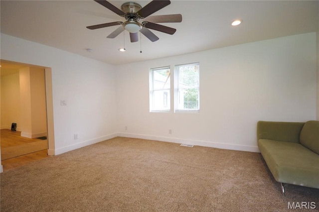 5444 Janet Ave, Jennings, MO 63136 - living area with light carpet, a ceiling fan, and recessed lighting