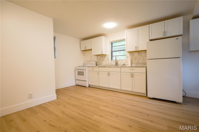 5444 Janet Ave, Jennings, MO 63136 - kitchen with white appliances, light wood-style floors, white cabinetry, tasteful backsplash, and light countertops