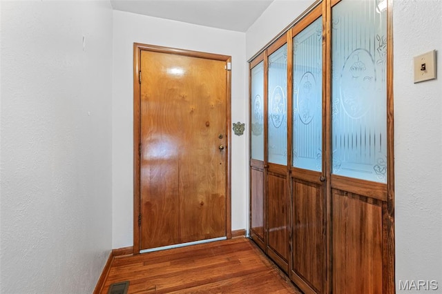 715 S A St, Farmington, MO 63640 - doorway featuring wood finished floors and baseboards