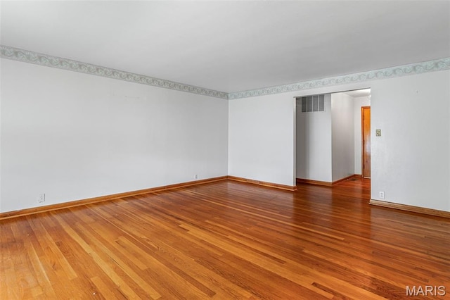 715 S A St, Farmington, MO 63640 - unfurnished room with wood finished floors and baseboards
