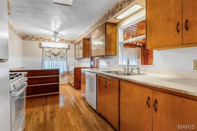 715 S A St, Farmington, MO 63640 - kitchen featuring white appliances, light wood-style flooring, light countertops, and ceiling fan