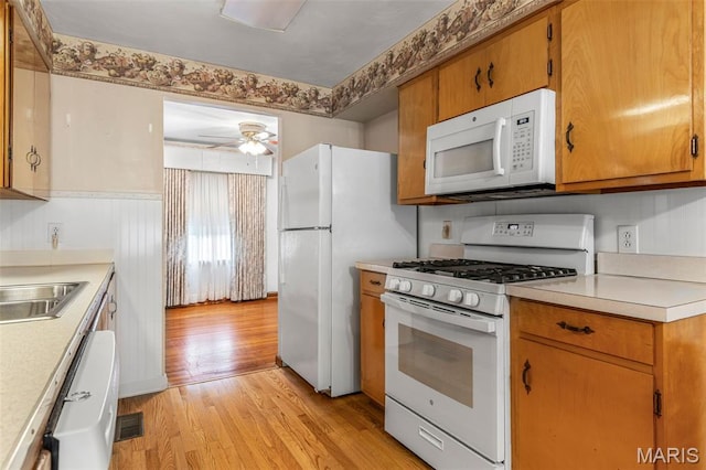 715 S A St, Farmington, MO 63640 - kitchen with white appliances, light countertops, light wood-style floors, and a ceiling fan