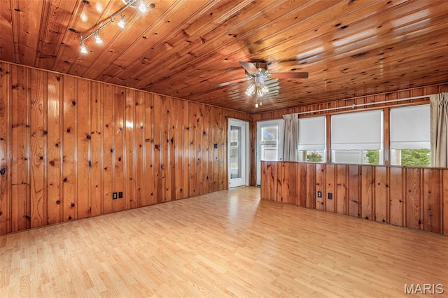 715 S A St, Farmington, MO 63640 - unfurnished room with wood finished floors, wooden walls, a ceiling fan, wood ceiling, and rail lighting